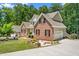 Beautiful two-story brick home with manicured lawn and charming landscaping at 1084 Wild Briar Ln, Stem, NC 27581
