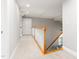 Hallway with a carpet, white trim, and view of the stairs at 1084 Wild Briar Ln, Stem, NC 27581
