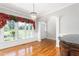 Elegant living area featuring hardwood floors, moldings and lots of natural light at 1084 Wild Briar Ln, Stem, NC 27581
