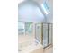 Bright bathroom featuring a jetted tub, skylight, and glass-enclosed shower, offering a spa-like experience at 109 N Fern Abbey Ln, Cary, NC 27518