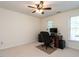 Bedroom converted to an office with a desk, computer, and ceiling fan, offering a productive workspace at 109 N Fern Abbey Ln, Cary, NC 27518