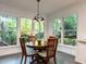 Breakfast area with lots of natural light from large windows provides picturesque views of the outdoors at 109 N Fern Abbey Ln, Cary, NC 27518