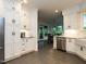 Open kitchen featuring white cabinets, stainless steel appliances, and a seamless transition to the breakfast area at 109 N Fern Abbey Ln, Cary, NC 27518