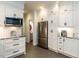 Well-lit kitchen with stainless steel appliances, white cabinets, and granite countertops offers both style and functionality at 109 N Fern Abbey Ln, Cary, NC 27518