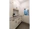Mudroom with white cabinetry, granite countertops, and exterior door offers a convenient transition space at 109 N Fern Abbey Ln, Cary, NC 27518
