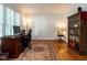 Bright office space with hardwood floors, area rug, and built-in shelving at 109 N Fern Abbey Ln, Cary, NC 27518