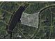 Aerial view of property showcasing lot size, boundaries, and surrounding landscape at 110 Wolfs Trl, Chapel Hill, NC 27516