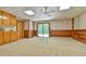 Spacious carpeted basement with wood paneling and walk-out at 110 Wolfs Trl, Chapel Hill, NC 27516