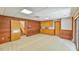 Spacious carpeted basement with wood paneling and walk-out at 110 Wolfs Trl, Chapel Hill, NC 27516