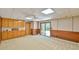 Spacious carpeted basement with wood paneling and walk-out at 110 Wolfs Trl, Chapel Hill, NC 27516