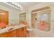 Well-lit bathroom with a tub-shower combo and vanity at 110 Wolfs Trl, Chapel Hill, NC 27516