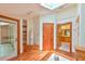 Bright bathroom featuring a walk-in shower, wood flooring, and storage at 110 Wolfs Trl, Chapel Hill, NC 27516
