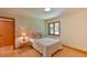 Cozy bedroom with hardwood floors and natural lighting at 110 Wolfs Trl, Chapel Hill, NC 27516