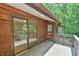 Exterior deck with a sliding glass door and backyard access, blending indoor and outdoor living at 110 Wolfs Trl, Chapel Hill, NC 27516