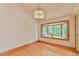 Cozy dining room with hardwood floors, large windows and chandelier at 110 Wolfs Trl, Chapel Hill, NC 27516