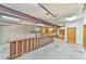 Spacious garage with overhead lighting, cabinetry, and concrete flooring at 110 Wolfs Trl, Chapel Hill, NC 27516