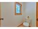This bathroom includes a toilet and a window providing outside views at 110 Wolfs Trl, Chapel Hill, NC 27516