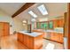 Modern kitchen with a large island, stainless steel appliances, and plenty of natural light at 110 Wolfs Trl, Chapel Hill, NC 27516