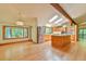 Spacious kitchen boasts wood cabinets, stainless steel appliances, skylights, and a central island at 110 Wolfs Trl, Chapel Hill, NC 27516