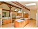 Well-lit kitchen with stainless steel appliances, large island, and skylights at 110 Wolfs Trl, Chapel Hill, NC 27516