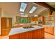 Charming kitchen features stainless steel appliances, wooden cabinets, and a central island at 110 Wolfs Trl, Chapel Hill, NC 27516
