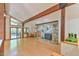 Spacious living area with stone fireplace, hardwood floors, and natural light at 110 Wolfs Trl, Chapel Hill, NC 27516