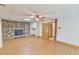 The living room has wood floors, a stone fireplace, and an open doorway at 110 Wolfs Trl, Chapel Hill, NC 27516