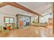 Cozy living room with stone fireplace, hardwood floors, and ample natural light at 110 Wolfs Trl, Chapel Hill, NC 27516
