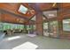 The patio features wooden beams, ceiling fans, stone columns, and rocking chairs at 110 Wolfs Trl, Chapel Hill, NC 27516