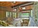 The patio features wooden beams, ceiling fans, stone columns, and rocking chairs at 110 Wolfs Trl, Chapel Hill, NC 27516