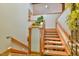Beautiful wooden staircase with natural lighting and greenery at 110 Wolfs Trl, Chapel Hill, NC 27516