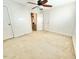 Cozy bedroom with ceiling fan, neutral carpeting, and closet space at 1112 N Driver St, Durham, NC 27701