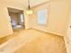 Bright dining area with a window and overhead lighting at 1112 N Driver St, Durham, NC 27701