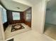 Living room with multiple windows, offering natural light, and an area rug at 1112 N Driver St, Durham, NC 27701