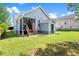Home exterior showing deck, stairs, and backyard lawn at 1138 Ricochet Dr, Raleigh, NC 27610