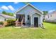 Exterior rear view showcasing lawn, deck, stairs, and blue siding at 1138 Ricochet Dr, Raleigh, NC 27610