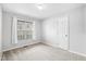 Clean and bright bedroom with light carpet and good natural light at 1138 Ricochet Dr, Raleigh, NC 27610
