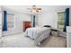 Bright bedroom with ceiling fan, neutral walls, carpet, and natural light at 1138 Ricochet Dr, Raleigh, NC 27610