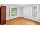 Clean, empty bedroom featuring wood floors and ample natural light at 1138 Ricochet Dr, Raleigh, NC 27610