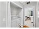 Convenient laundry area featuring washer, dryer, and adjacent bedroom view at 1138 Ricochet Dr, Raleigh, NC 27610