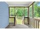 Screened porch with wood flooring overlooking backyard at 1138 Ricochet Dr, Raleigh, NC 27610