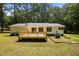 Charming home featuring a spacious back deck, perfect for outdoor gatherings and relaxation in a serene backyard setting at 117 Lema Dr, Garner, NC 27529