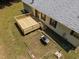 Aerial shot of backyard with newly-constructed deck, grill, and green grass at 117 Lema Dr, Garner, NC 27529