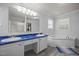 Well-lit bathroom featuring a double sink vanity, soaking tub, and neutral paint at 117 Lema Dr, Garner, NC 27529