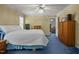 Relaxing bedroom with blue carpet, wardrobe closets, and ample natural light at 117 Lema Dr, Garner, NC 27529