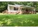 Exterior shot of home and wrap-around porch at 117 Lema Dr, Garner, NC 27529