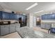 Bright kitchen featuring granite countertops, breakfast bar, and stainless steel appliances at 117 Lema Dr, Garner, NC 27529