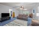 Bright and airy living room showcasing ceiling fan, plush seating, and cozy ambiance at 117 Lema Dr, Garner, NC 27529