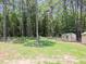 Spacious backyard featuring two storage sheds, enclosed by a secure chain-link fence at 117 Renee Dr, Smithfield, NC 27577