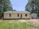 This is a backyard view of the home with a fenced-in yard and metal storage building at 117 Renee Dr, Smithfield, NC 27577